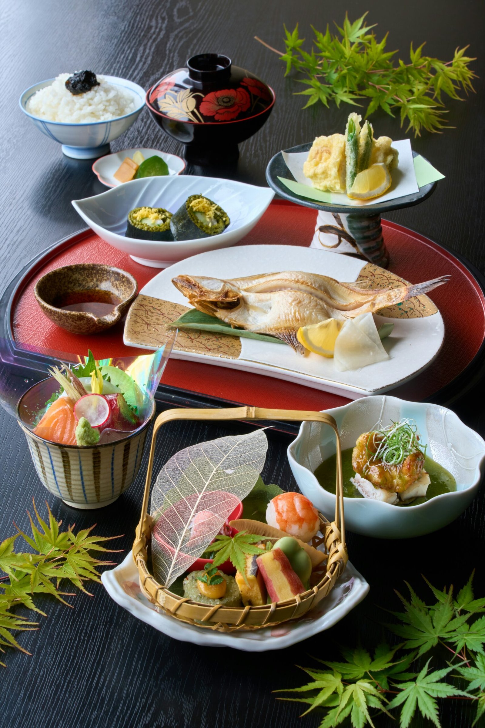 A table topped with plates and bowls filled with food